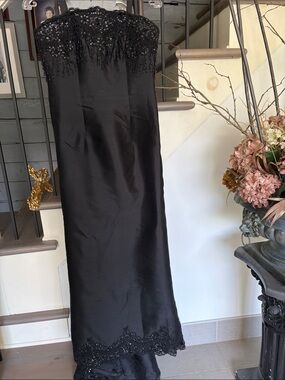 Jovani Black Strapless Beaded Evening Gown Elegant is the word for this gown